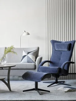 Delta Motion Fåtölj med Pall | Original | Fårskinn